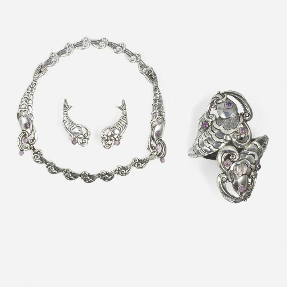 A single auction lot of Margot de Taxco's Double Fish parure: necklace, earrings, and cuff bracelet, each stamped 5207.