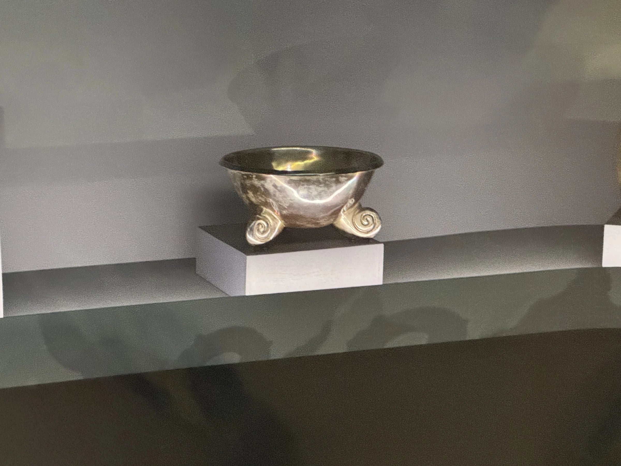 Tripod bowl with scroll feet